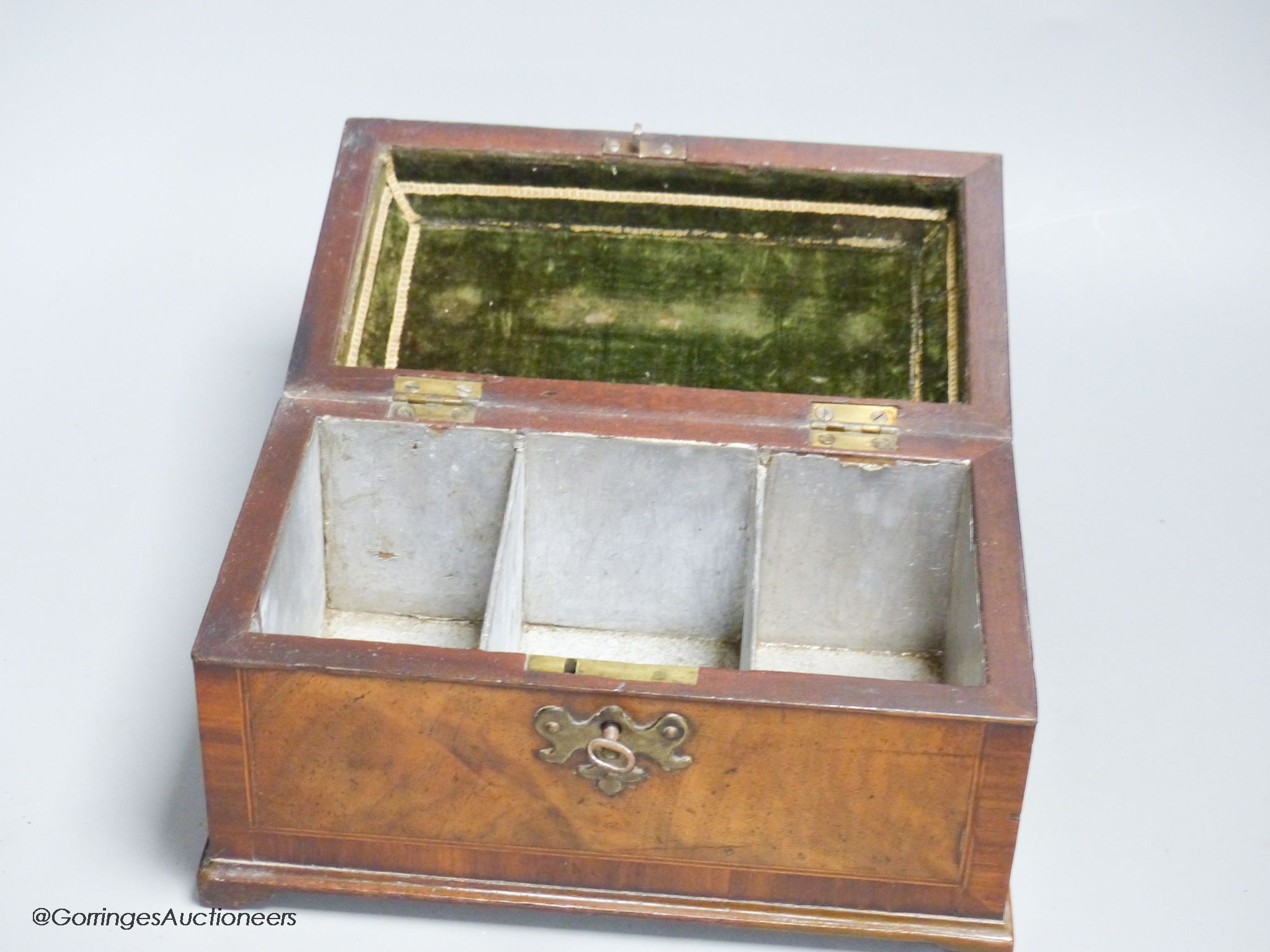 A late George II walnut line inlaid and cross banded tea caddy